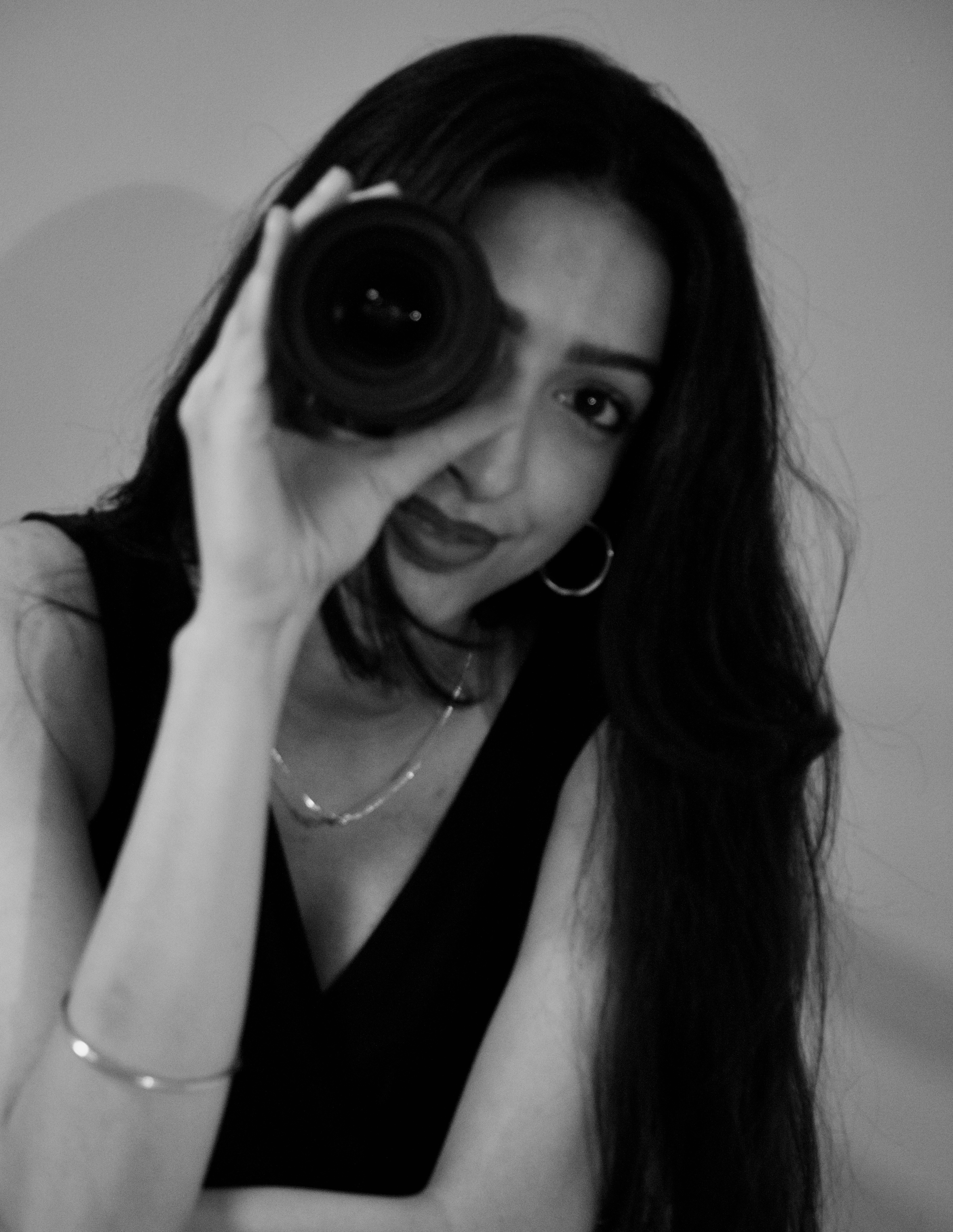 Photo of Manmeet Sagri, with a camera lens